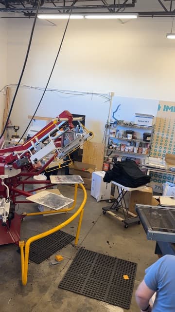 Screen printing in progress at the Utah Shirt Shop press